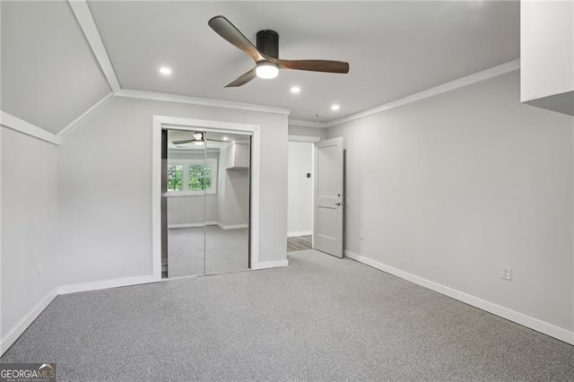 unfurnished bedroom with ornamental molding, recessed lighting, baseboards, a closet, and carpet floors