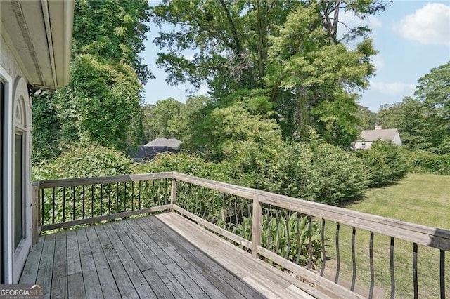 deck featuring a lawn