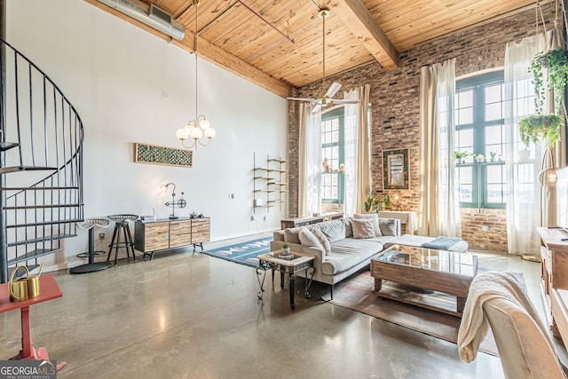 170 Boulevard Se 521H, Atlanta, GA 30312 - living area with wooden ceiling with exposed beams, stairway, concrete flooring, a towering ceiling, and brick wall
