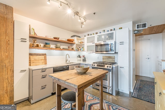 170 Boulevard Se 521H, Atlanta, GA 30312 - kitchen featuring stainless steel appliances, a sink, decorative backsplash, and open shelves