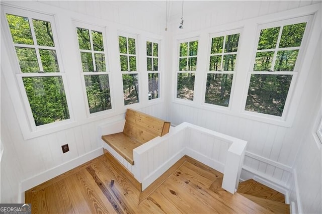unfurnished sunroom featuring healthy amount of natural light