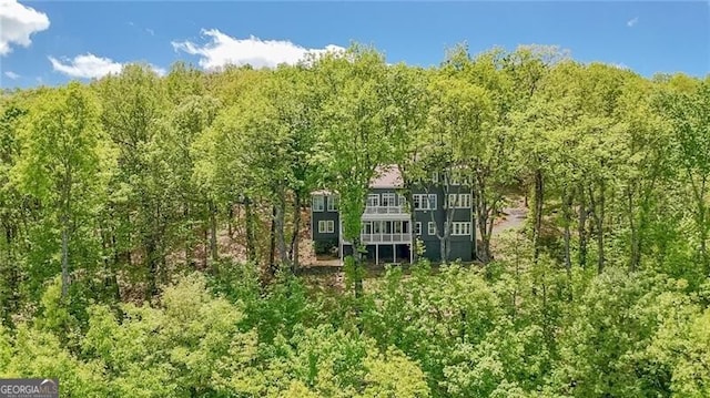 view from above of property featuring a forest