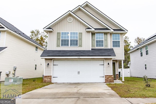 view of front of home featuring board and batten siding, brick siding, concrete driveway, a garage, and a front lawn
