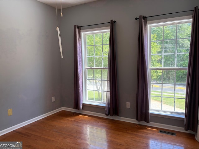 2828 Hicks Rd SW, Marietta, GA 30060 - spare room with plenty of natural light, wood finished floors, and baseboards