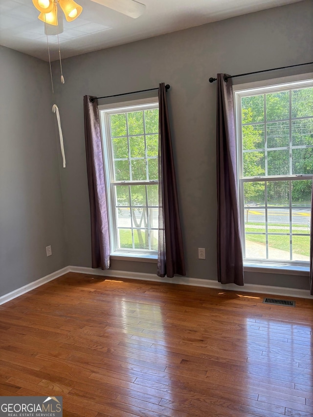 2828 Hicks Rd SW, Marietta, GA 30060 - spare room with plenty of natural light, hardwood / wood-style flooring, and baseboards