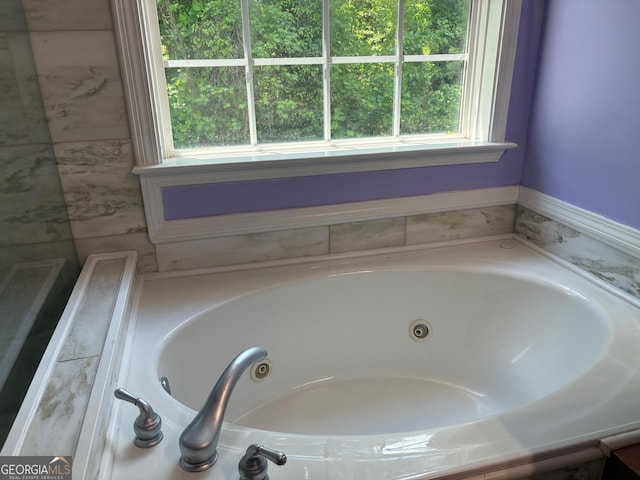 2828 Hicks Rd SW, Marietta, GA 30060 - bathroom featuring a tub with jets