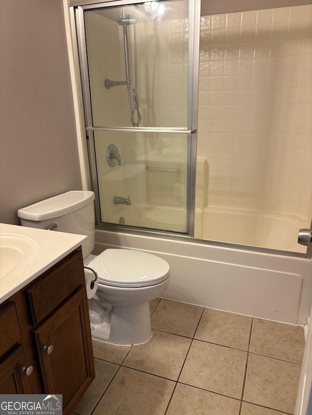 2828 Hicks Rd SW, Marietta, GA 30060 - bathroom with tile patterned flooring, vanity, combined bath / shower with glass door, and toilet