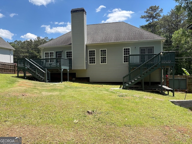 2828 Hicks Rd SW, Marietta, GA 30060 - rear view of house with stairway, a wooden deck, a shingled roof, and a chimney