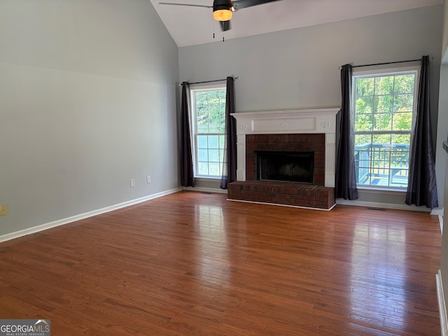 2828 Hicks Rd SW, Marietta, GA 30060 - unfurnished living room with a ceiling fan, plenty of natural light, wood finished floors, and high vaulted ceiling