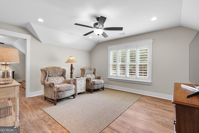 sitting room featuring lofted ceiling, a ceiling fan, wood finished floors, recessed lighting, and baseboards