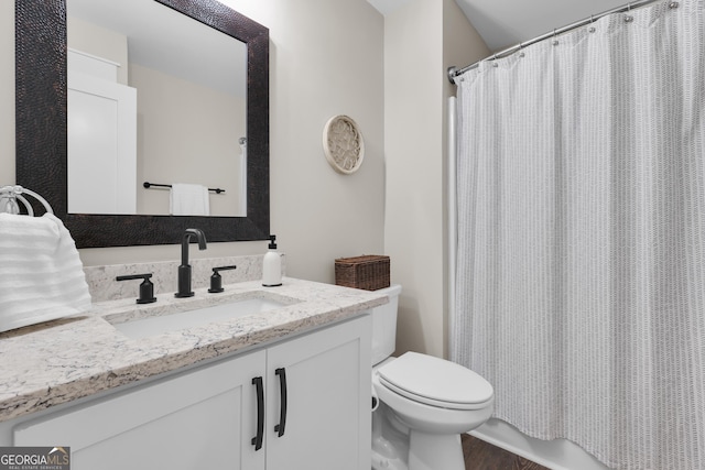 full bath featuring toilet, vanity, a shower with curtain, and wood finished floors