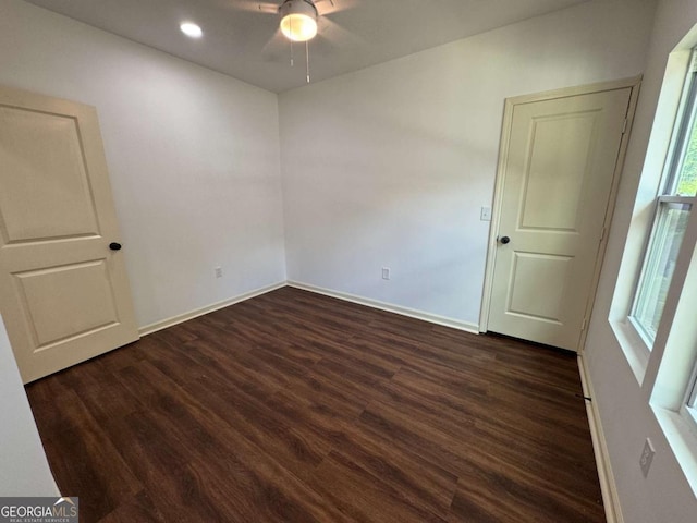 unfurnished room with dark wood-style floors, ceiling fan, baseboards, and recessed lighting