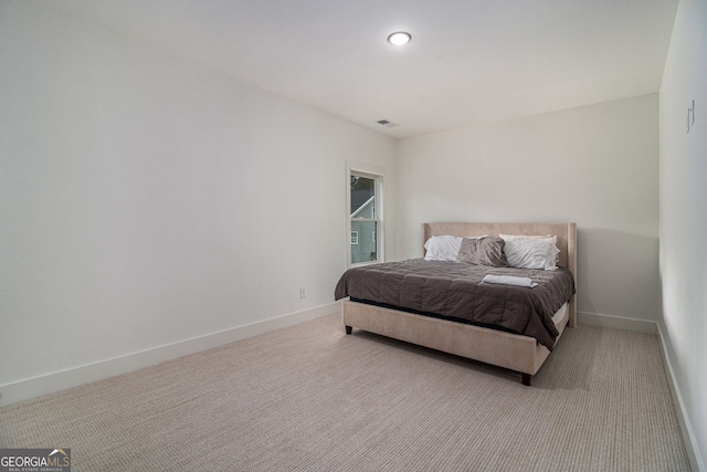 bedroom with carpet and baseboards