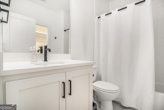 bathroom with toilet, shower / bath combination with curtain, vanity, and tile patterned flooring