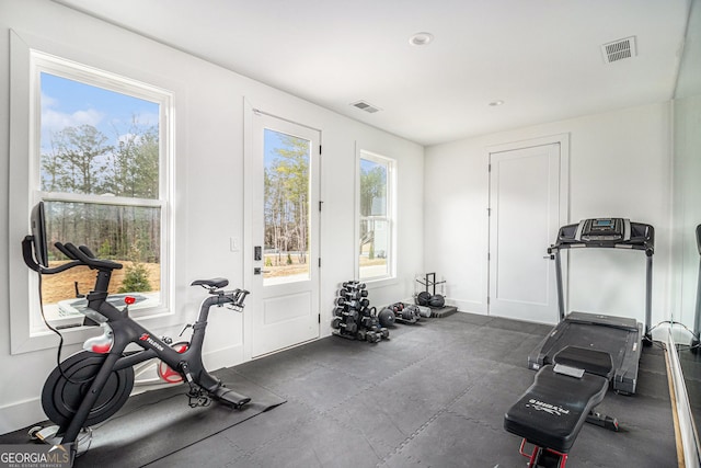 exercise room featuring baseboards