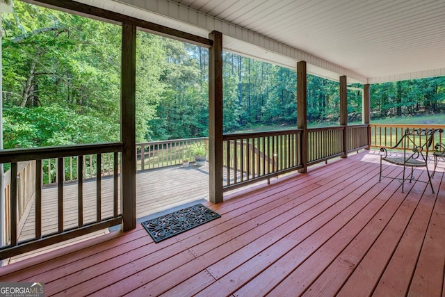 349 Bowen Hill Rd, Haddock, GA 31033 - wooden deck with a wooded view