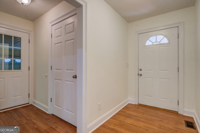 349 Bowen Hill Rd, Haddock, GA 31033 - entrance foyer with light wood-type flooring and baseboards