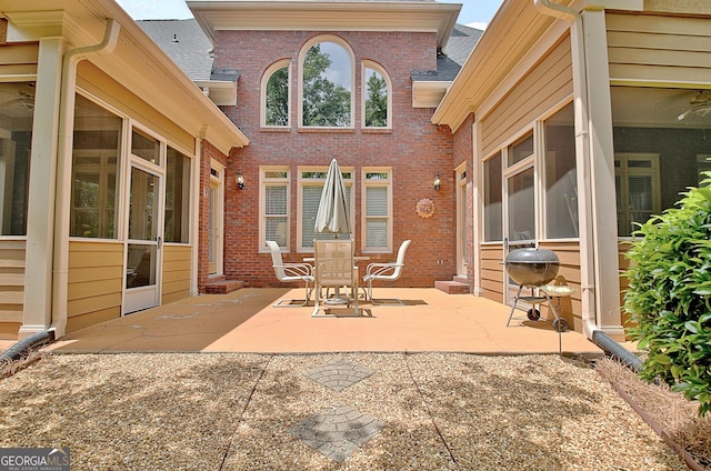view of patio featuring a sunroom and grilling area