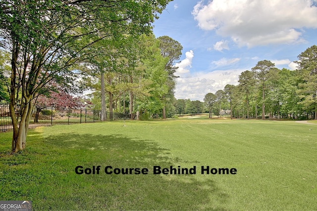 surrounding community featuring view of wooded area