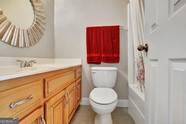 full bath featuring tile patterned floors, toilet, vanity, and baseboards