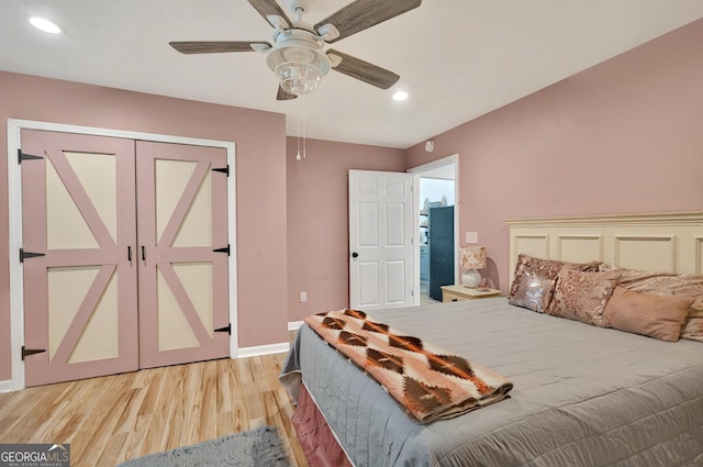 bedroom with light wood finished floors, recessed lighting, a closet, a ceiling fan, and baseboards