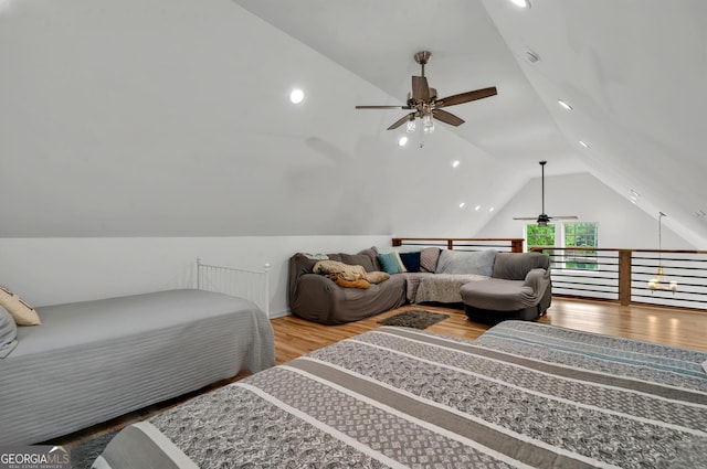 bedroom featuring lofted ceiling, wood finished floors, and recessed lighting
