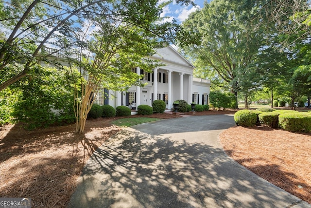 3818 Sweet Bottom Dr, Duluth, GA 30096 - neoclassical home with driveway, a porch, and stucco siding