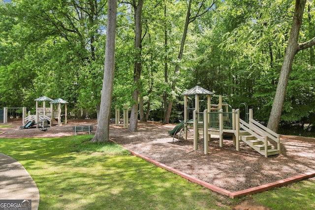 community jungle gym featuring a yard