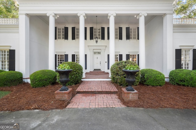 view of front of home featuring stucco siding and a porch