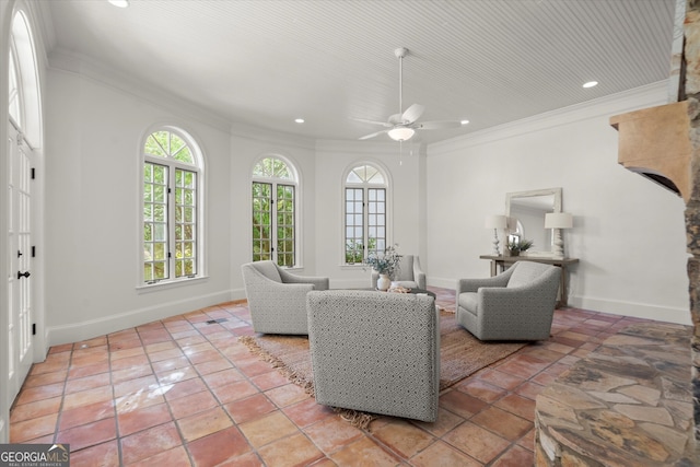 living area with crown molding, ceiling fan, recessed lighting, and baseboards
