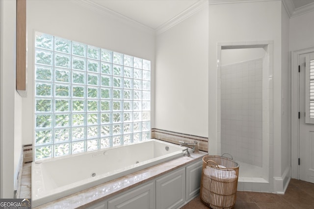 bathroom with a jetted tub, ornamental molding, a walk in shower, and tile patterned flooring