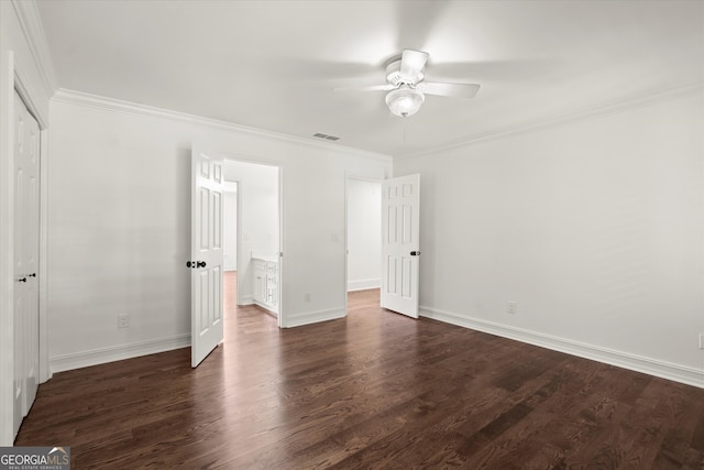 unfurnished bedroom with crown molding, dark wood-type flooring, baseboards, and a ceiling fan