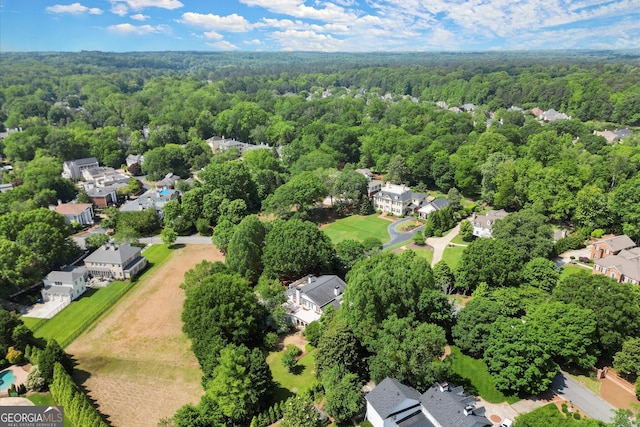 aerial perspective of suburban area with a forest