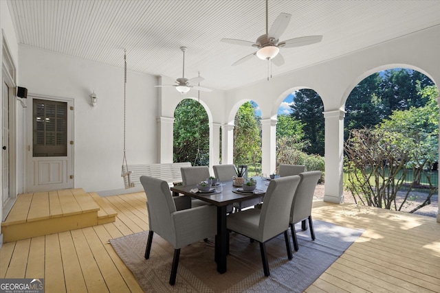 deck featuring a ceiling fan and outdoor dining space