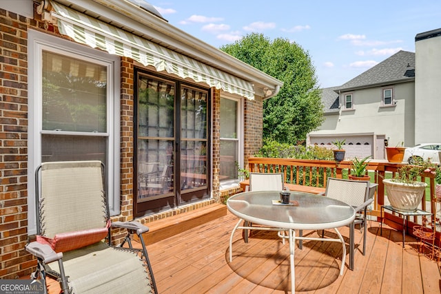 wooden deck with outdoor dining area