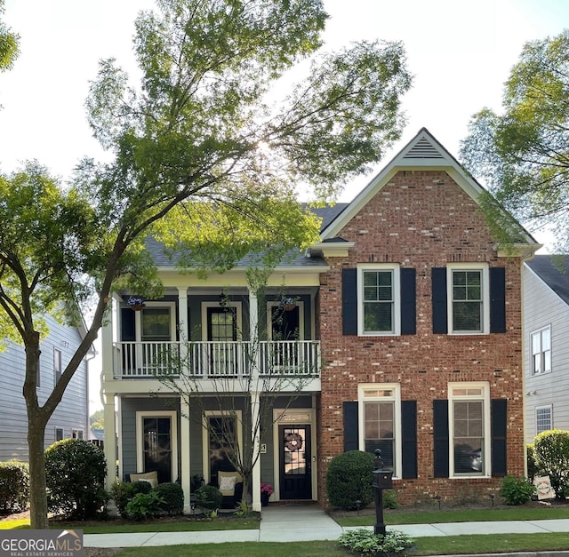 655 Grove Manor Ct, Suwanee, GA 30024 - view of front of property featuring a balcony and brick siding