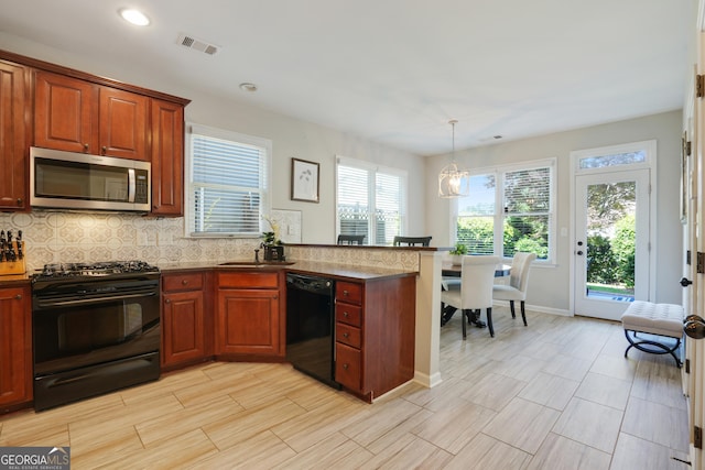 655 Grove Manor Ct, Suwanee, GA 30024 - kitchen featuring black appliances, a peninsula, recessed lighting, backsplash, and decorative light fixtures