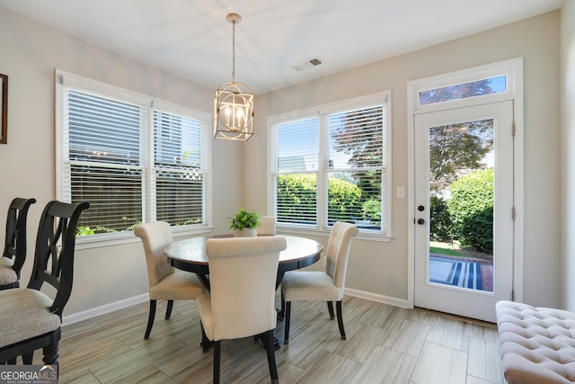 655 Grove Manor Ct, Suwanee, GA 30024 - dining space with a chandelier and baseboards