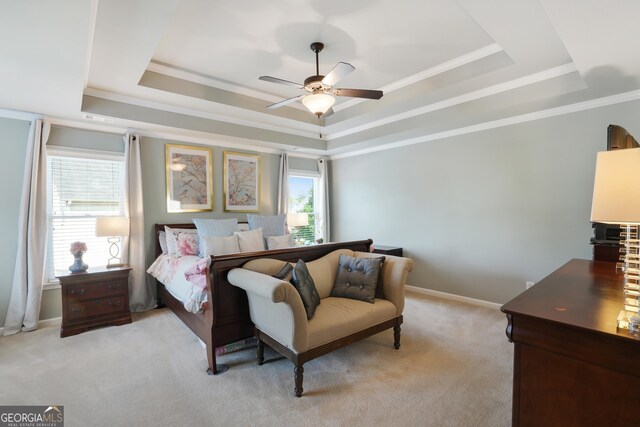 655 Grove Manor Ct, Suwanee, GA 30024 - bedroom featuring a tray ceiling, light colored carpet, ornamental molding, and a ceiling fan