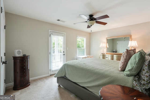 655 Grove Manor Ct, Suwanee, GA 30024 - bedroom with access to exterior, light carpet, and a ceiling fan