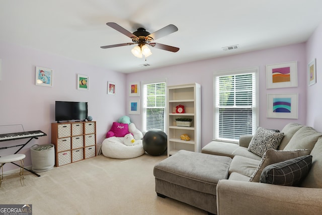 655 Grove Manor Ct, Suwanee, GA 30024 - carpeted living room with plenty of natural light and a ceiling fan