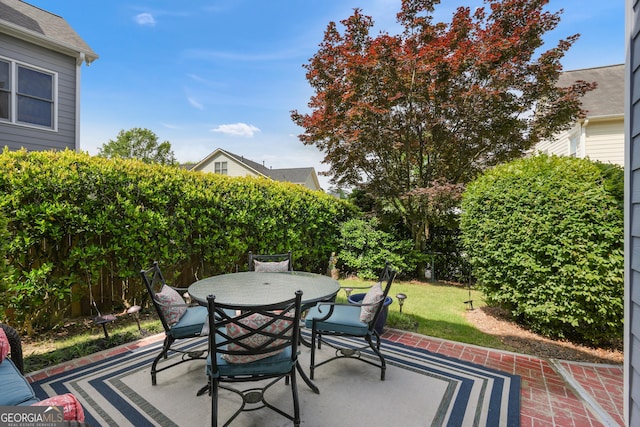 655 Grove Manor Ct, Suwanee, GA 30024 - fenced backyard featuring a patio and outdoor dining area