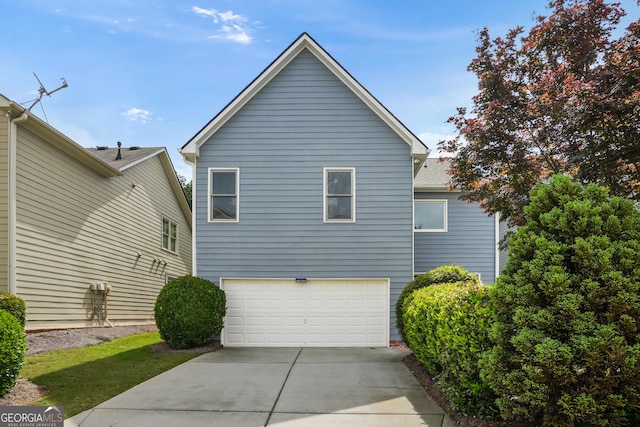655 Grove Manor Ct, Suwanee, GA 30024 - view of property exterior with a garage and concrete driveway