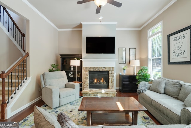 655 Grove Manor Ct, Suwanee, GA 30024 - living area with stairway, wood finished floors, crown molding, a stone fireplace, and a ceiling fan