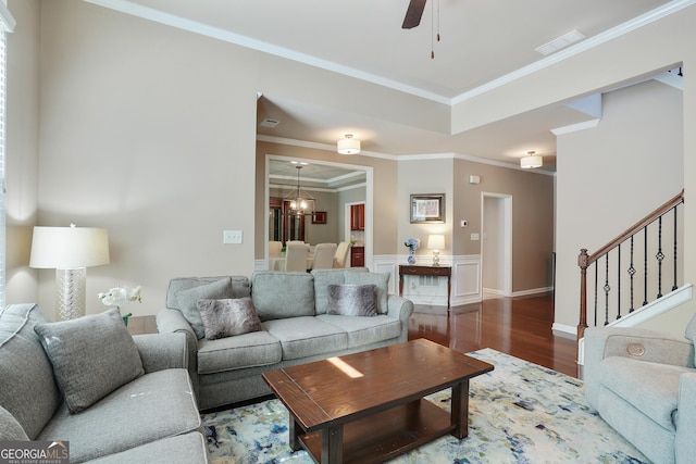 655 Grove Manor Ct, Suwanee, GA 30024 - living room with wood finished floors, stairs, crown molding, and a ceiling fan