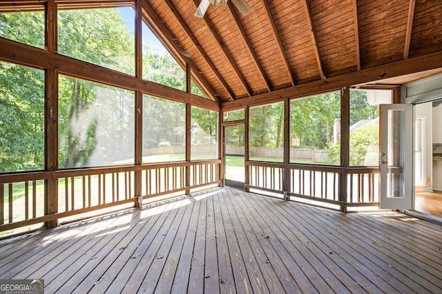 unfurnished sunroom with plenty of natural light and ceiling fan