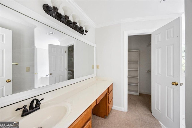 bathroom featuring vanity, ornamental molding, and baseboards
