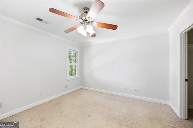 unfurnished room featuring crown molding, baseboards, light colored carpet, and ceiling fan