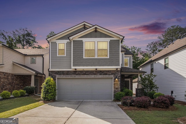 2769 Morgan Spring Trl, Buford, GA 30519 - view of front of home featuring concrete driveway, stone siding, a garage, and board and batten siding