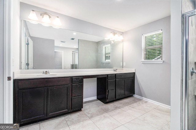2769 Morgan Spring Trl, Buford, GA 30519 - full bathroom featuring double vanity, baseboards, and an enclosed shower